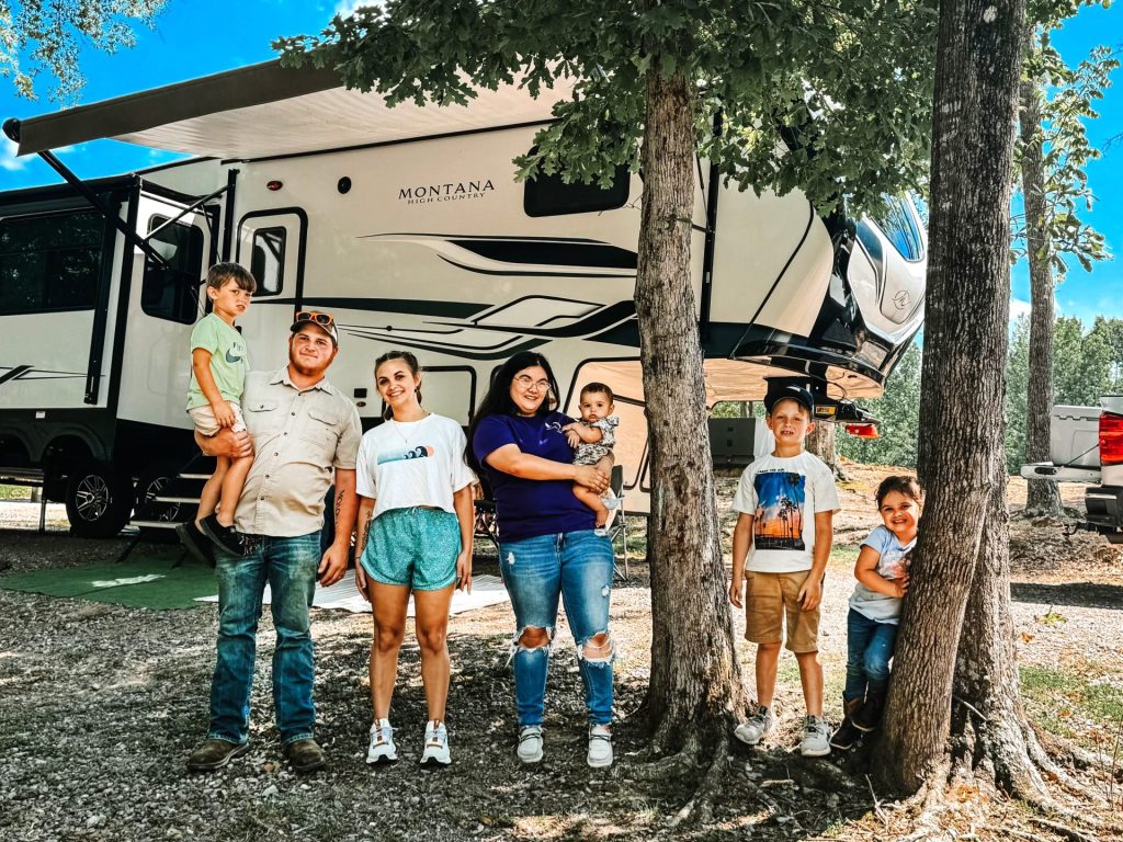 Family with their RV truck at RV Park